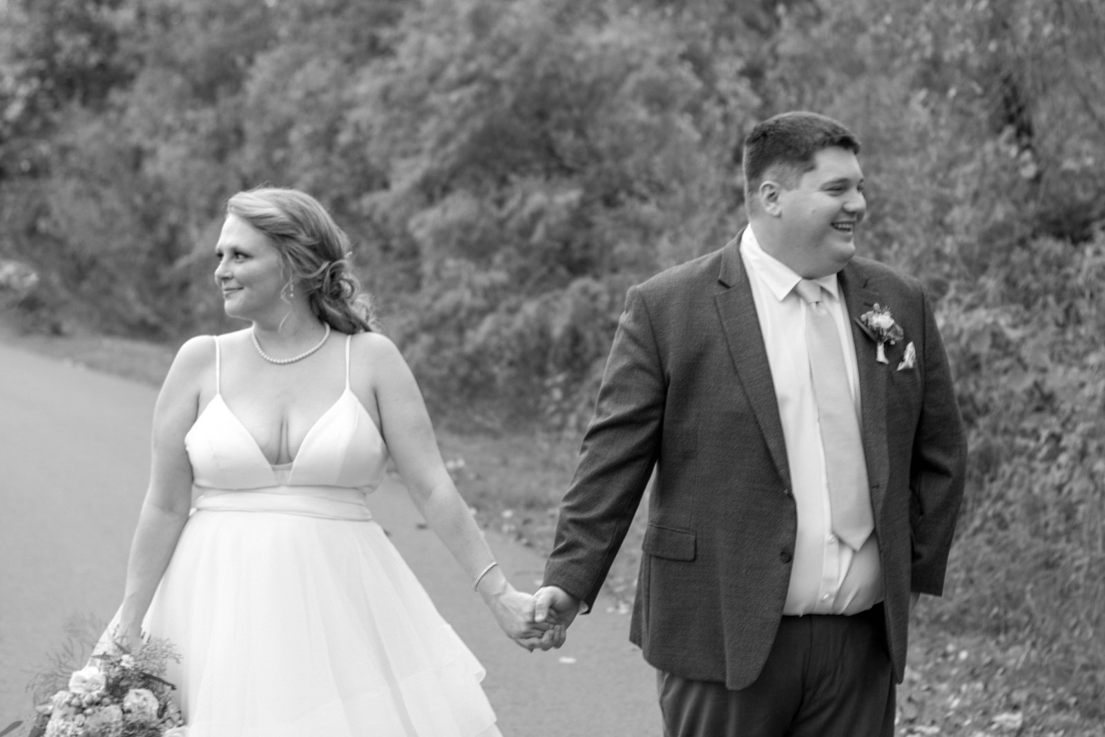 Black and white photo of couple holding hands, Twin Cities wedding photography