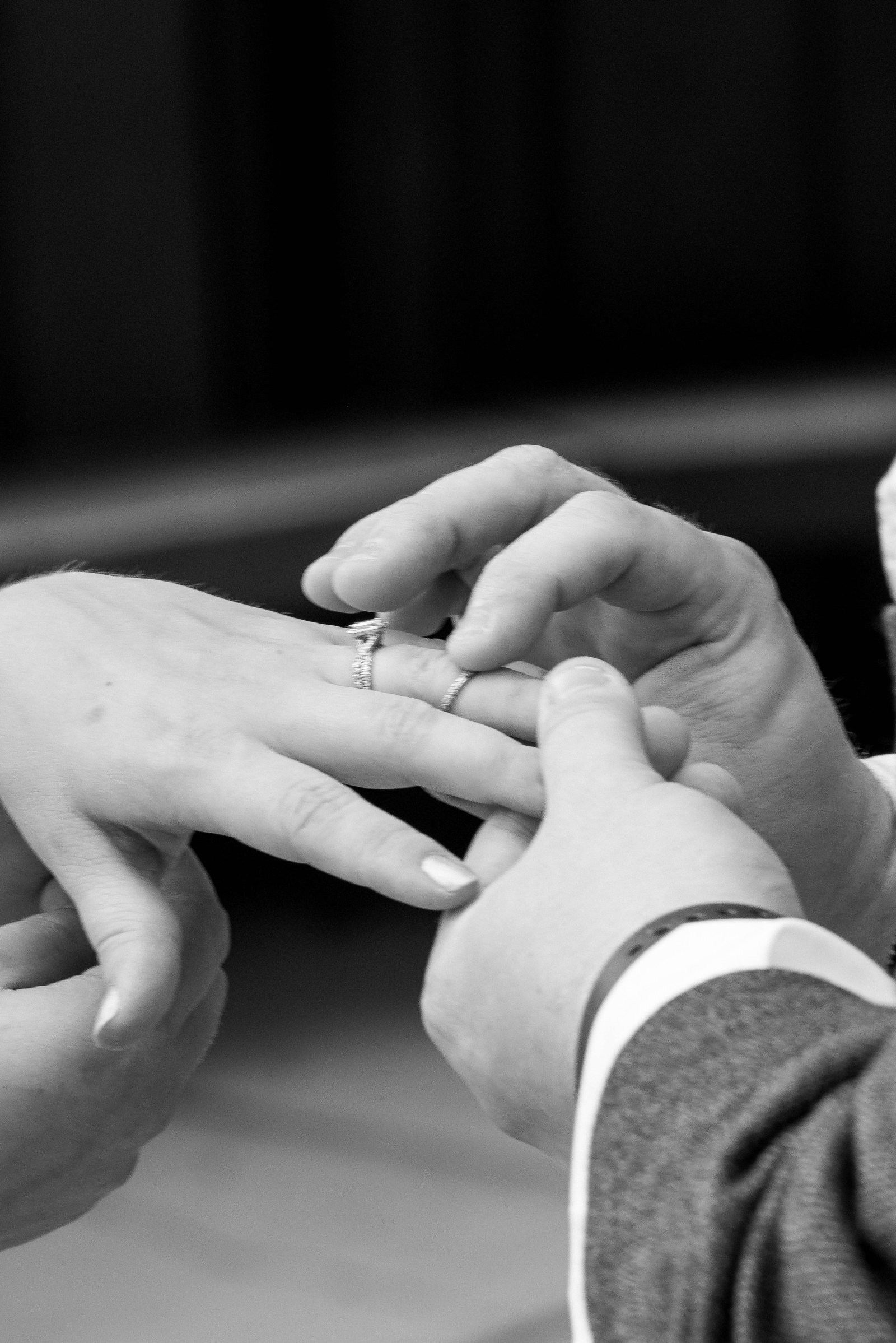 placing the ring on her finger